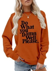 Detail of orange crewneck sweatshirt with Do What YOU Damn Well Please print and ribbed cuffs