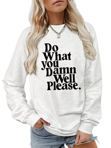 Close-up of 'Do What You Damn Well Please' text on gray crewneck sweatshirt fabric