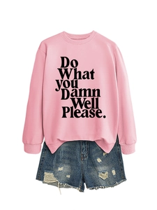 Pink crewneck sweatshirt with 'Do What YOU Damn Well Please' print and ripped denim shorts
