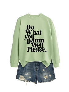 Detail of light green sweatshirt with 'Do What YOU Damn Well Please' slogan print