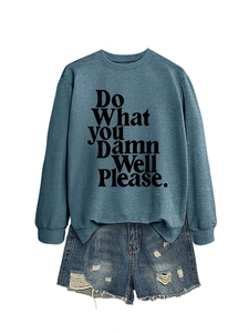 Detail of blue crewneck sweatshirt with Do What You Damn Well Please print and denim shorts