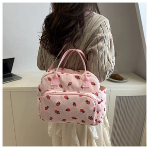 Pink strawberry corduroy tote bag detail showing textured fabric and side pockets