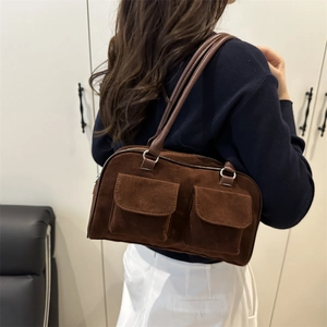 Retro brown suede shoulder bag with dual front pockets and long leather handles