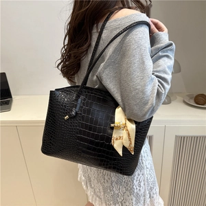 Fashionable black crocodile pattern tote bag for women with yellow silk scarf accessory