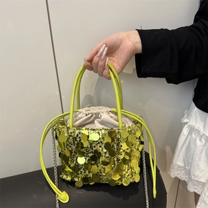 Fashionable fluorescent green sequined bucket bag with silver chain strap and drawstring
