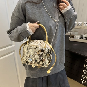 Fashionable bucket bag with gold sequins, drawstring closure and chain strap