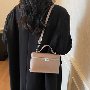 Minimalist brown lychee leather crossbody square bag with silver heart zipper detail