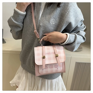 Pink and white checkered mini backpack with cartoon bear print and gold hardware detail