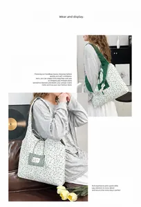 Detailed view of floral canvas tote bag showing side plaid pocket and neat stitching