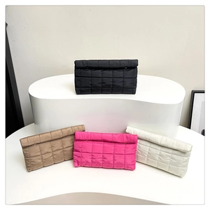 Quilted nylon cosmetic bags in black, khaki, rose and white on tiered display stands