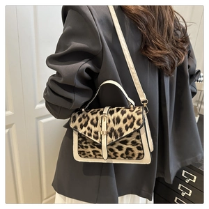 Detailed view of the leopard print flap and metallic buckle on the crossbody square bag