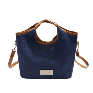 Retro-Unterarmtasche aus Denim mit braunen Ledergriffen und verstellbarem Schultergurt