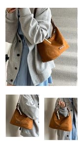 Detailed macro view of caramel faux suede crescent bag with beaded strap and stitching
