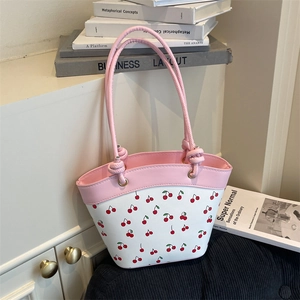 Pink and white cherry print shoulder tote bag in a minimalist aesthetic lifestyle setting