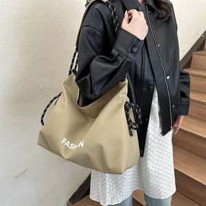 Khaki large capacity nylon crossbody bag with drawstring closure and striped strap