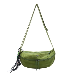 Lightweight grass green nylon crescent crossbody bag with adjustable strap and charm