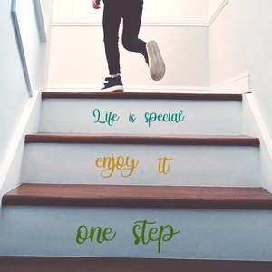 Close-up of inspirational stair decals showing Life is special text on a wooden staircase
