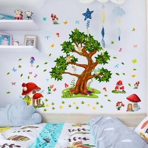Detail of forest tree and mushroom house wall stickers in a cozy child's bedroom setting