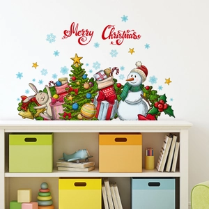 Detailed view of Christmas snowman wall stickers on a white wall in a cozy room decor