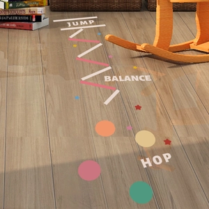 Interactive sensory motor floor stickers for kids with jump and balance path on wood floor