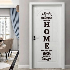 Vertical black vinyl home wall decal with welcome lettering on a modern white interior door