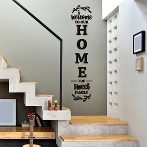 Modern black Welcome To Our Home wall decal with botanical motifs for cozy living spaces