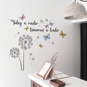 Macro detail of inspirational wall decal with dandelions and colorful butterflies