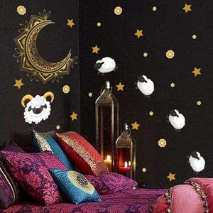 Close-up of golden moon, stars, and sheep stickers for Eid al-Adha bedroom decoration