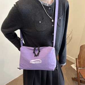 Chic purple nylon crossbody pillow bag with adjustable strap and branding for women