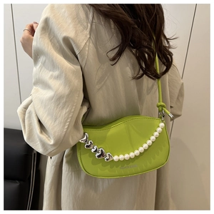 Lime green crescent shoulder bag with silver heart chain and white pearl detail