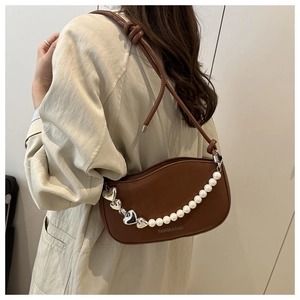 Brown leather underarm bag featuring white pearl chains and silver heart metal detail
