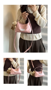 Pink patent leather half-moon bag with adjustable strap and cute bear plush charm