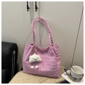 Detailed pink waffle texture tote bag with hand-woven handle and cute cloud charm