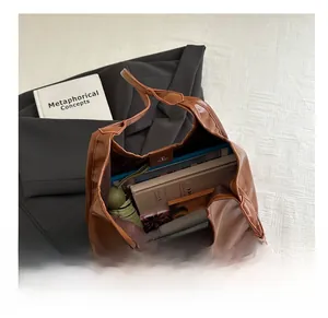 Deep brown large capacity tote bag showing internal storage for books and umbrella