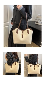 Detail of lychee pattern tote bag with beige leather and golden metal buckle closure