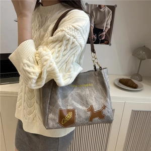 Chic grey textured tote bag with leather-chain strap and playful puppy patch design