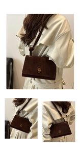 Detail of dark brown suede shoulder bag featuring a unique knotted strap and gold clasp