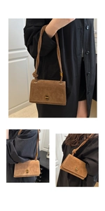 Detail of caramel brown suede handbag showing golden twist lock and knotted shoulder strap