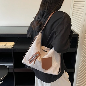 Minimalist large capacity tote bag in beige canvas with brown leather pocket and straps