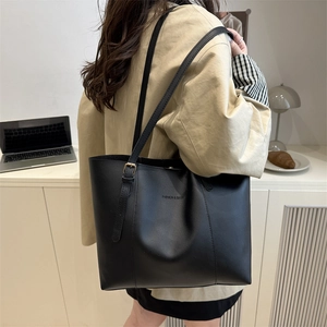 Minimalist large black tote bag in high-quality faux leather for daily commuting