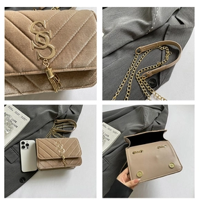 Detail of tan quilted crossbody bag with golden monogram logo and chain strap