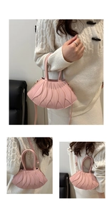 Detail of pink faux leather bag with unique layered leaf-shaped 3D petal decorations