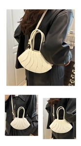 Detailed views of a white shell-shaped shoulder bag with tiered leaf pleat textures