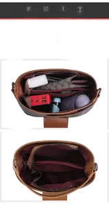 Interior view of large capacity brown leather bucket bag with three storage compartments