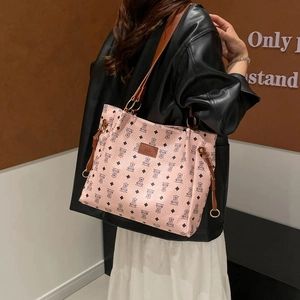 Pink tote bag with bear monogram pattern and brown shoulder straps for women