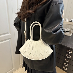 White minimalist pleated fan-shaped shoulder bag with gold hardware and top handle
