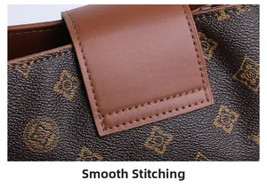 Detailed close-up of smooth stitching on brown retro printed leather bucket bag