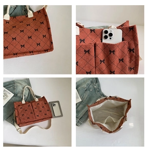 Detailed view of corduroy tote bag showing large pockets and spacious interior capacity