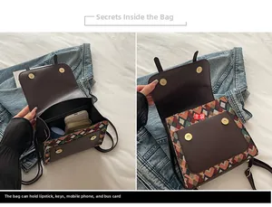 Detail view of the vintage bag interior showing main compartment for phone and wallet
