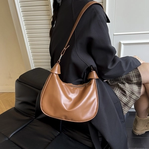 Retro brown half-moon leather shoulder bag with adjustable strap for women commuting